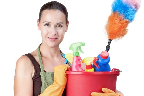 Cleaning professional using protective equipment during a deep cleaning task