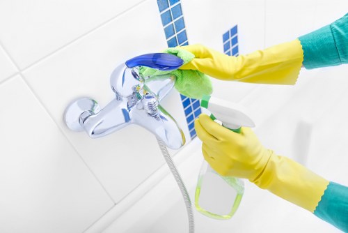 Local cleaning team working in a Brixton flat with access challenges
